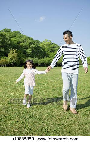 Father and daughter holding hands View Large Photo Image Stock Photo - Father and daughter holding hands. Fotosearch