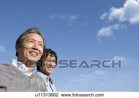 Father and Son Against Blue Sky View Large Photo Image Stock Image - Father and Son Against Blue Sky. Fotosearch