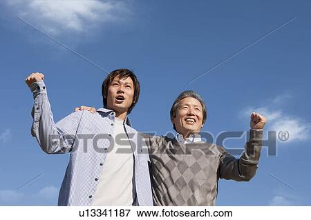 Father and Son Against Blue Sky View Large Photo Image Stock Photo - Father and Son Against Blue Sky. Fotosearch