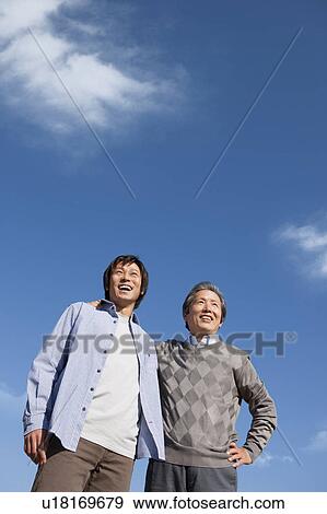 Father and Son Against Blue Sky View Large Photo Image Stock Photo - Father and Son Against Blue Sky. Fotosearch