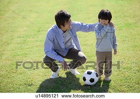 Father and Son with Soccer Ball View Large Photo Image Stock Image - Father and Son with Soccer Ball. Fotosearch