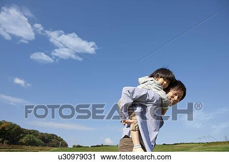 Father Carrying Boy on Back View Large Photo Image Stock Image - Father Carrying Boy on Back. Fotosearch