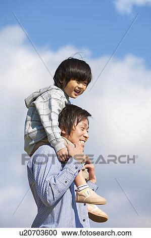 Father Carrying Boy on Shoulders View Large Photo Image Stock Image - Father Carrying Boy on Shoulders. Fotosearch