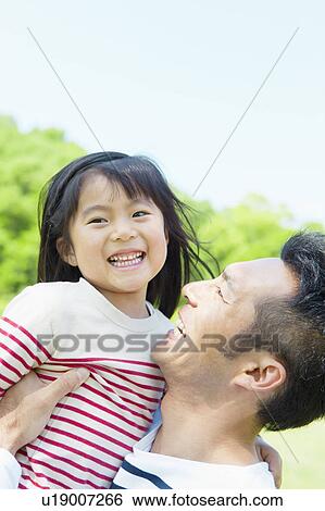 Father carrying daughter View Large Photo Image Stock Photograph - Father carrying daughter. Fotosearch