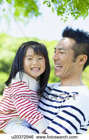 Father carrying daughter View Large Photo Image Stock Photograph - Father carrying daughter. Fotosearch