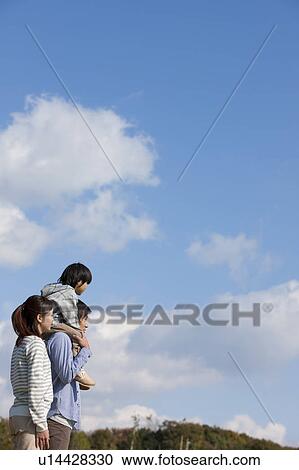 Father Carrying Son on Shoulders, Mother Beside View Large Photo Image Stock Image - Father Carrying Son on Shoulders, Mother Beside. Fotosearch