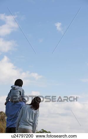 Father Carrying Son on Shoulders, Mother Beside View Large Photo Image Stock Image - Father Carrying Son on Shoulders, Mother Beside. Fotosearch