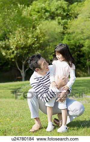 Father embracing daughter View Large Photo Image Picture - Father embracing daughter. Fotosearch