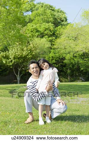 Picture - Father embracing daughter. Fotosearch