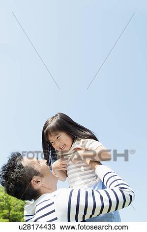Father picking up daughter View Large Photo Image Stock Image - Father picking up daughter. Fotosearch