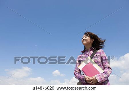 Female College Student Against Sky View Large Photo Image Stock Photograph - Female College Student Against Sky. Fotosearch