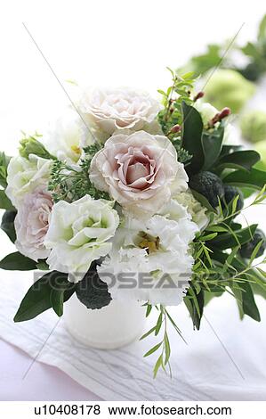 Stock Photo - Flower Arrangement of Roses, Texas Bluebell, and Yuzu. Fotosearch
