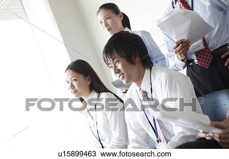 Four Businesspeople Listening to Presentation View Large Photo Image Stock Image - Four Businesspeople Listening to Presentation. Fotosearch