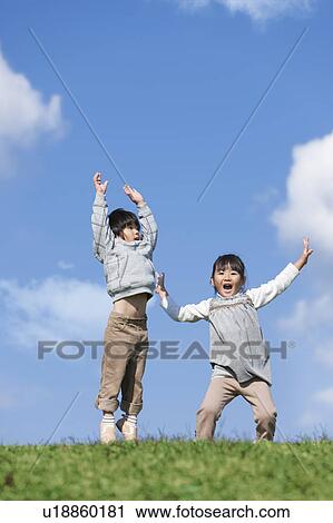 Girl and Boy Jumping View Large Photo Image Stock Image - Girl and Boy Jumping. Fotosearch