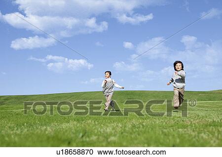 Girl and Boy Running in Field View Large Photo Image Stock Image - Girl and Boy Running in Field. Fotosearch