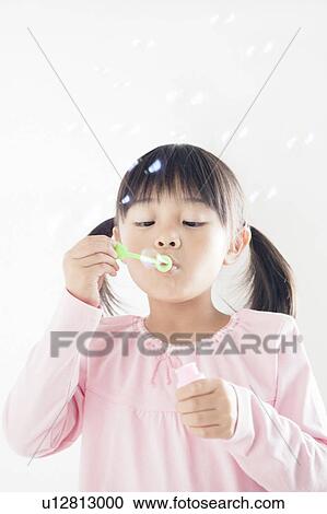 Girl Blowing Bubbles View Large Photo Image Stock Image - Girl Blowing Bubbles. Fotosearch