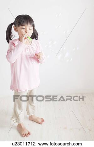 Girl Blowing Bubbles View Large Photo Image Stock Image - Girl Blowing Bubbles. Fotosearch