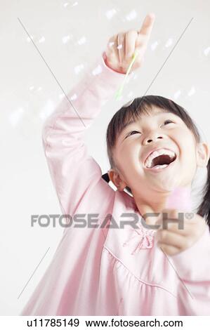 Girl Blowing Bubbles View Large Photo Image Stock Photo - Girl Blowing Bubbles. Fotosearch