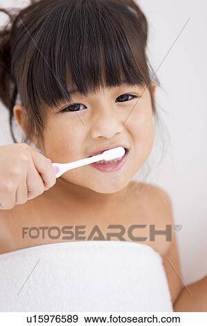Girl brushing teeth View Large Photo Image Stock Photo - Girl brushing teeth. Fotosearch