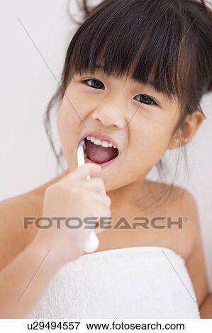 Girl brushing teeth View Large Photo Image Stock Photo - Girl brushing teeth. Fotosearch