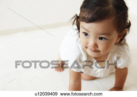 Stock Photo - Girl crawling. Fotosearch