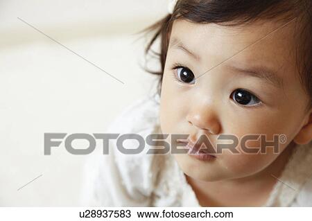 Stock Image - Girl looking away. Fotosearch