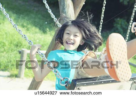 Girl on Swing View Large Photo Image Stock Photo - Girl on Swing. Fotosearch