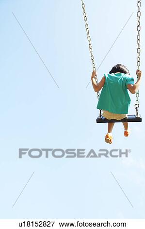 Stock Photo - Girl on Swing. Fotosearch