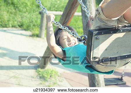 Girl on Swing View Large Photo Image Stock Photo - Girl on Swing. Fotosearch
