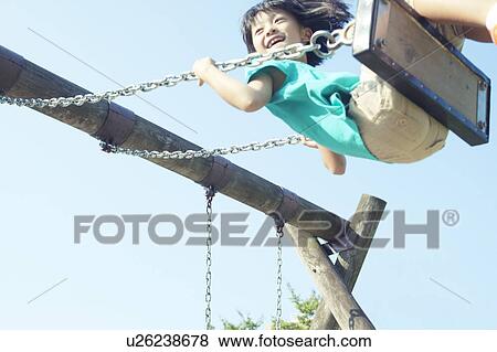 Girl on Swing View Large Photo Image Stock Photo - Girl on Swing. Fotosearch