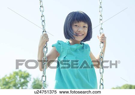 Stock Photography - Girl on Swing. Fotosearch