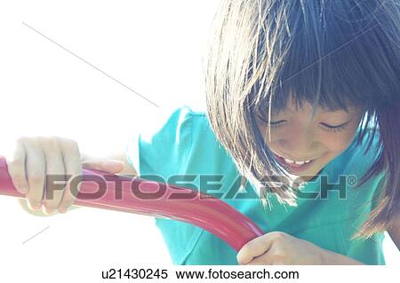 Stock Photography - Girl Playing in Playground. Fotosearch