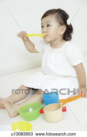 Girl playing tea party View Large Photo Image Stock Image - Girl playing tea party. Fotosearch