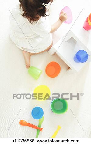 Girl playing tea party View Large Photo Image Stock Photograph - Girl playing tea party. Fotosearch