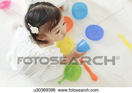Girl playing tea party View Large Photo Image Stock Photograph - Girl playing tea party. Fotosearch
