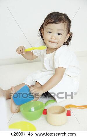 Girl playing tea party View Large Photo Image Stock Photography - Girl playing tea party. Fotosearch