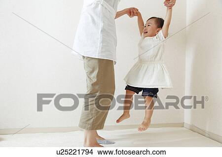 Girl playing with mom View Large Photo Image Picture - Girl playing with mom. Fotosearch