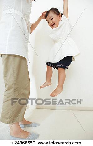 Girl playing with mom View Large Photo Image Stock Image - Girl playing with mom. Fotosearch