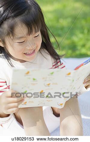 Girl reading a book View Large Photo Image Stock Image - Girl reading a book. Fotosearch