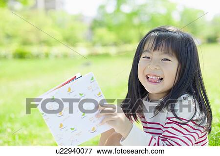 Stock Photo - Girl reading a book. Fotosearch