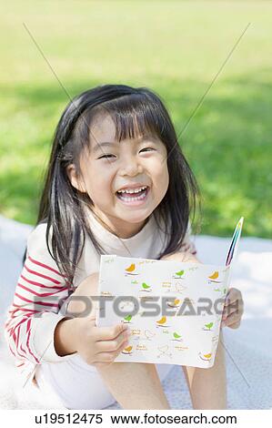 Stock Photography - Girl reading a book. Fotosearch
