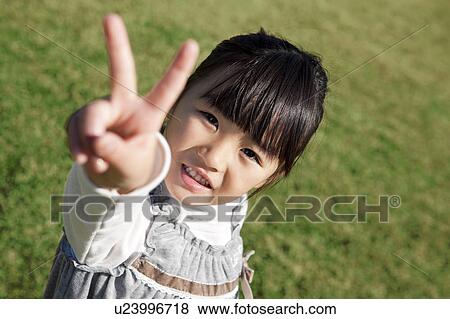 Stock Photo - Girl Showing V-Sign. Fotosearch