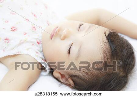 Stock Photography - Girl sleeping. Fotosearch