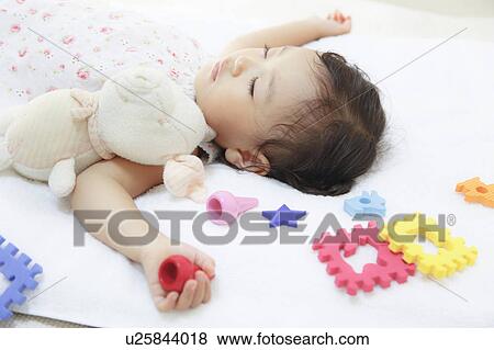Girl sleeping with stuffed animal View Large Photo Image Stock Photo - Girl sleeping with stuffed animal. Fotosearch