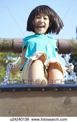 Girl Standing on Swing View Large Photo Image Stock Photograph - Girl Standing on Swing. Fotosearch