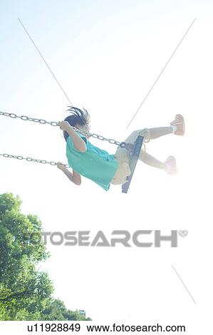 Stock Photo - Girl Swinging. Fotosearch