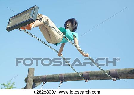 Stock Photo - Girl Swinging. Fotosearch