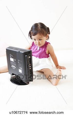 Girl watching television View Large Photo Image Picture - Girl watching television. Fotosearch