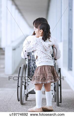 Granddaughter Pushing Grandmother in Wheelchair View Large Photo Image Stock Image - Granddaughter Pushing Grandmother in Wheelchair. Fotosearch
