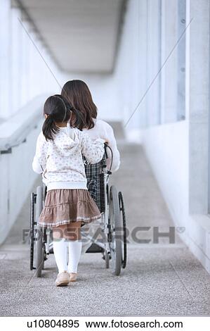 Granddaughter Pushing Grandmother in Wheelchair View Large Photo Image Stock Photography - Granddaughter Pushing Grandmother in Wheelchair. Fotosearch